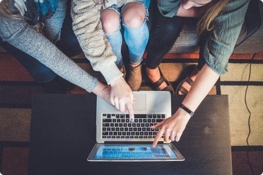 People Pointing to Computer